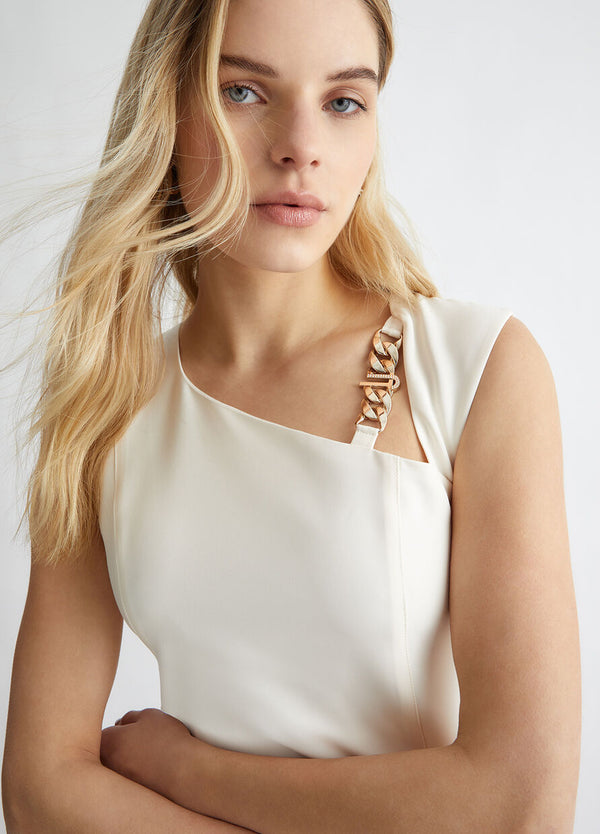 white dress with branded chain detail