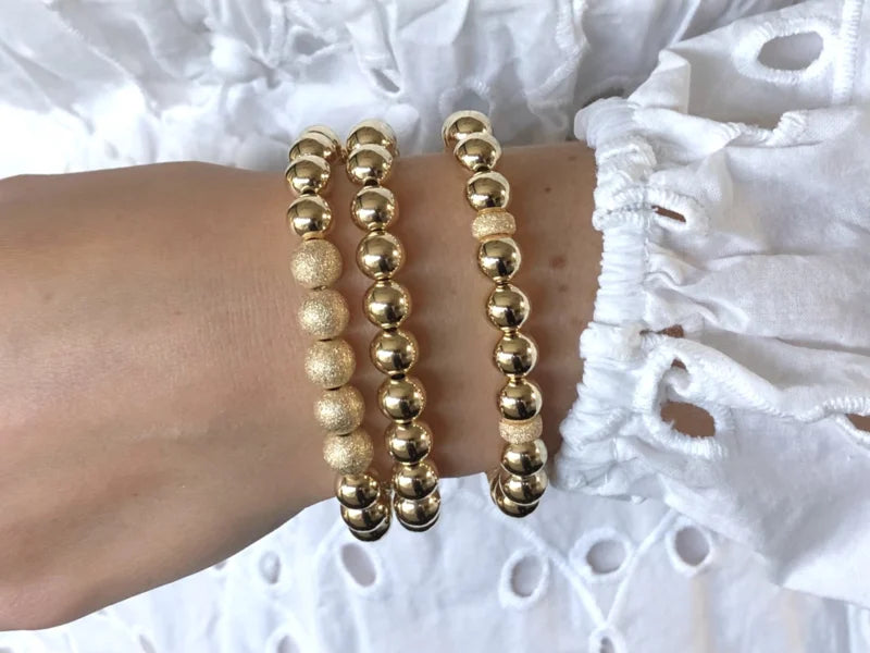 Armband Nikkie met stardust wieltjes en real gold plated balletjes